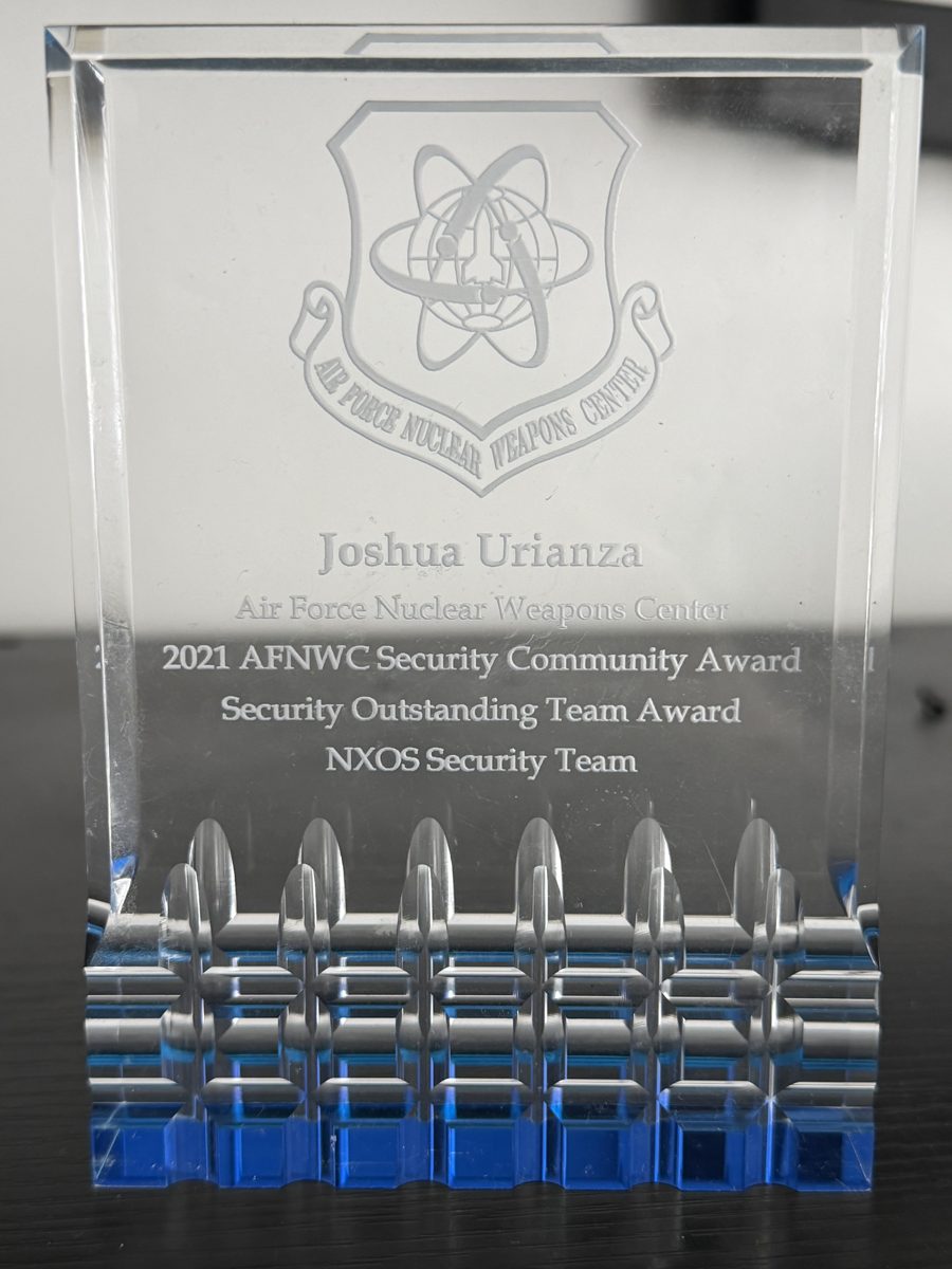 2021 AFNWC Security Community Award crystal plaque presented to Joshua Urianza, NXOS Security Team